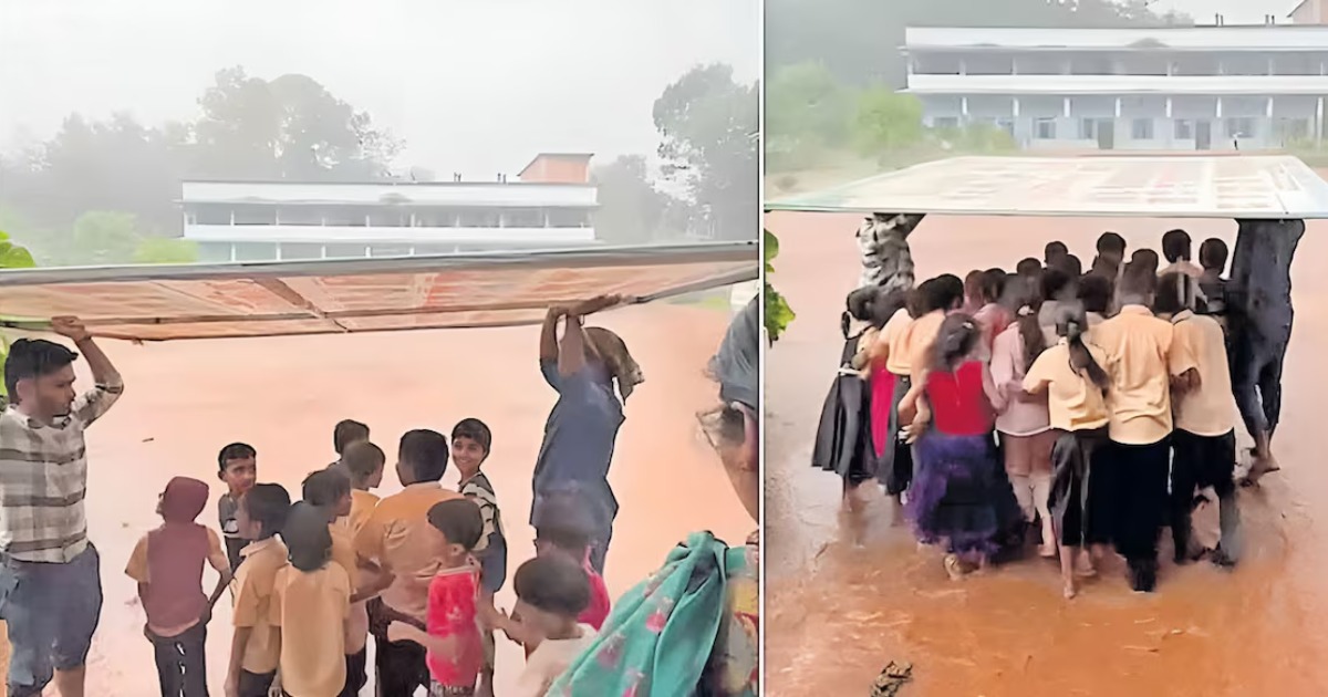  കുട്ടികളെ മഴ നനയാതെ ക്ലാസിലെത്തിക്കാൻ ഫ്ലെക്സ് ബോർഡ് കുടയാക്കി അധ്യാപകൻ; വൈറലായി വണ്ടൂരിലെ മാഷിന്റെ കരുതൽ